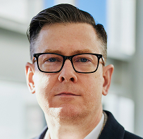 Alexander Hughes, CEO e executivo de uma empresa de negociação de criptomoedas, em foto de retrato